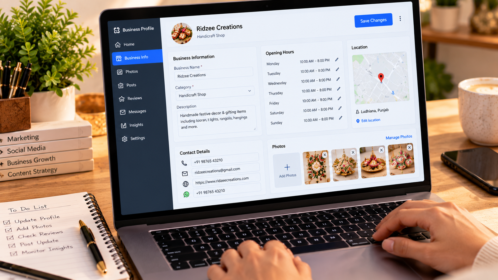 "Laptop displaying a business profile management dashboard with business category, opening hours, contact information, location map, and product photo upload options."
